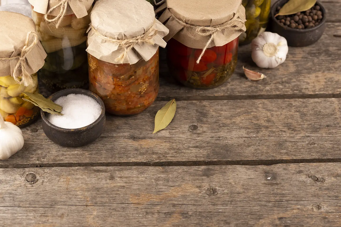 Fermentation variations in jars on a wooden table