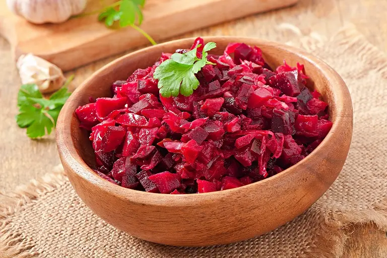 Mediterranean Style Fermented Grated Beetroot in a wooden bowl