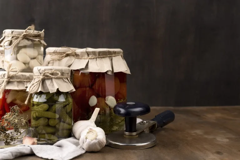Vegetable fermentation in jars and a press-down tool beside.